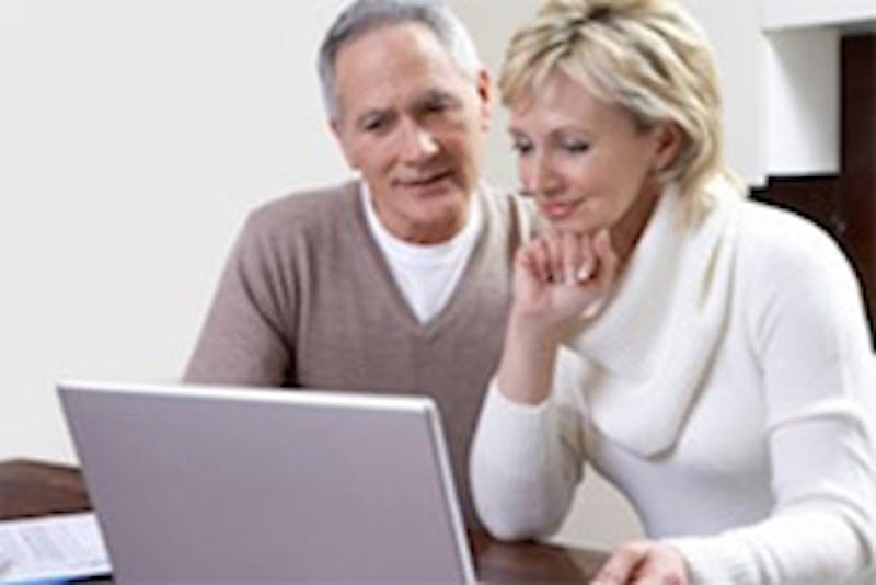 Older Couple Looking at a Laptop
