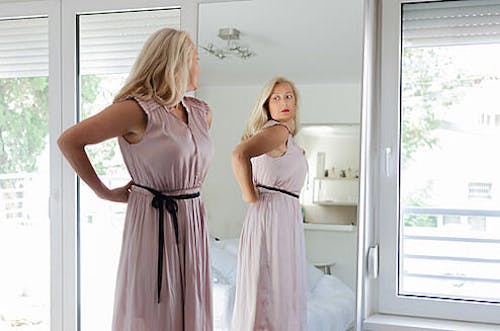 Woman Trying on her Dress