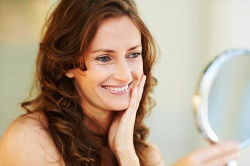 Woman looking at her reflection