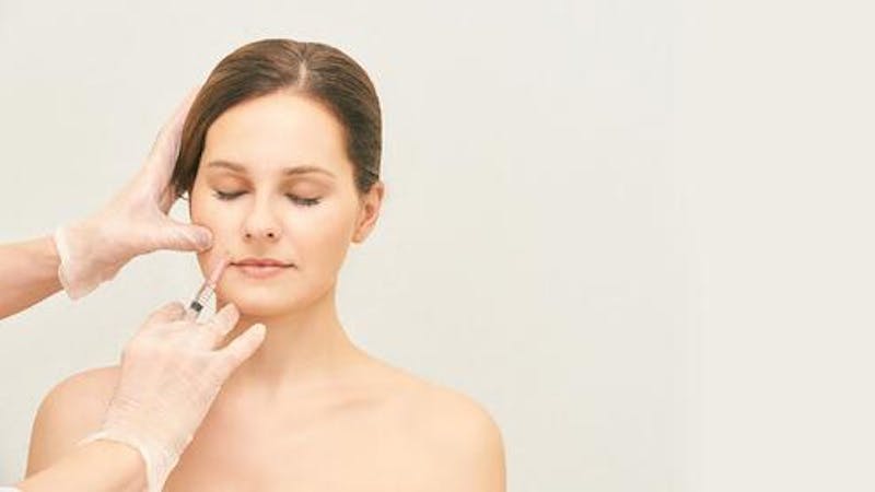 Patient Receiving Lip Injection