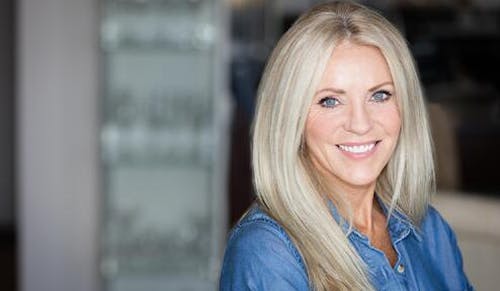 Woman with long blonde/grey hair