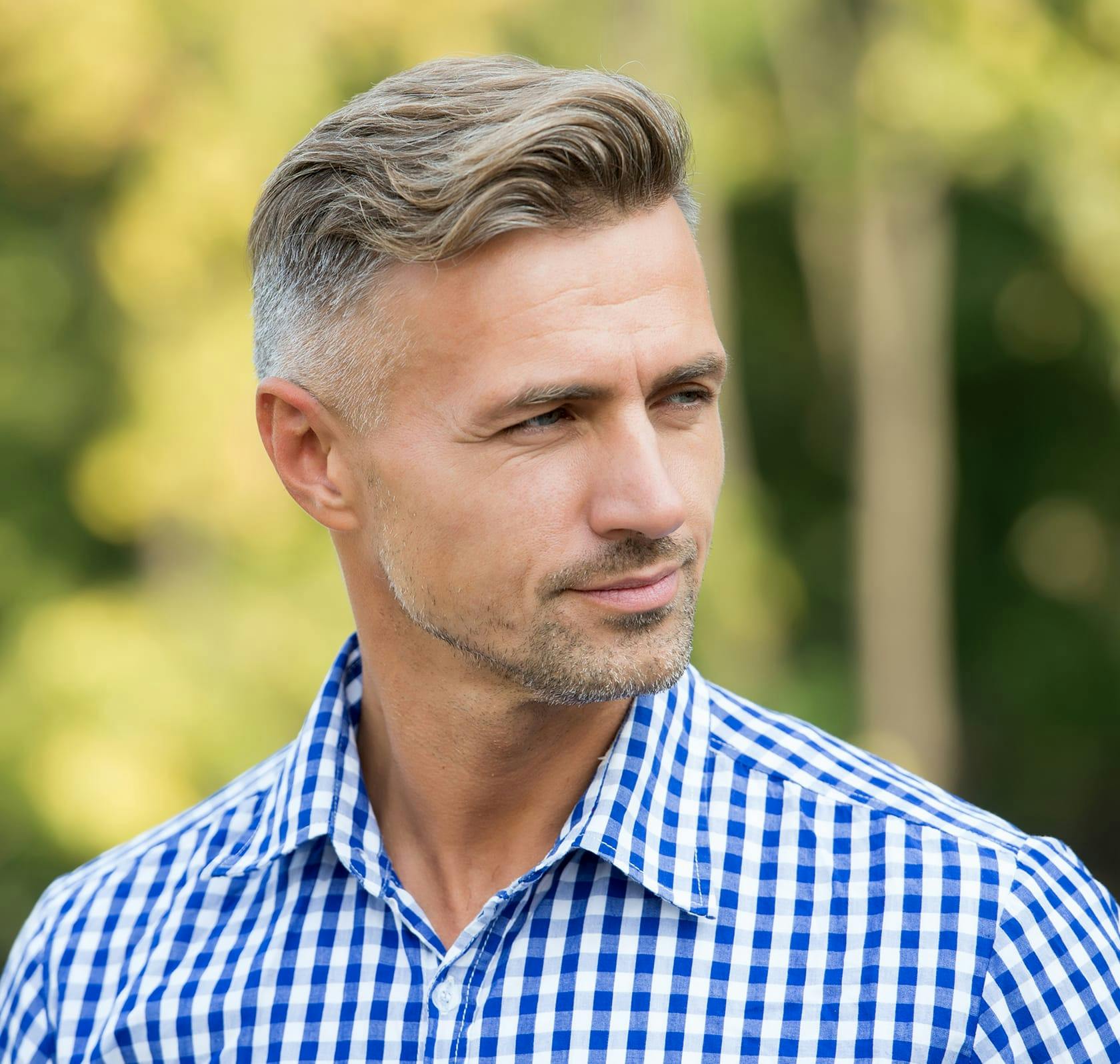 man in a blue and white button up top