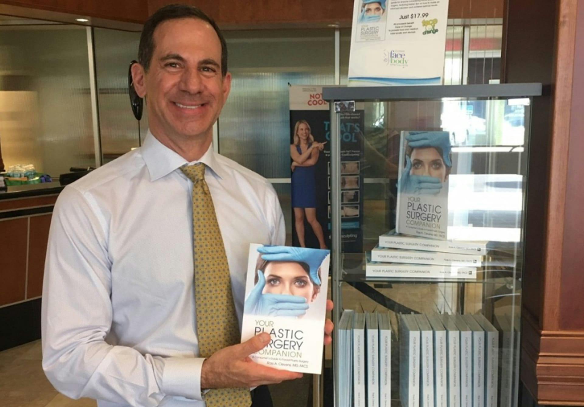 Dr. Clevens showcasing Clevens Face and Body Specialists' Plastic Surgery Companion