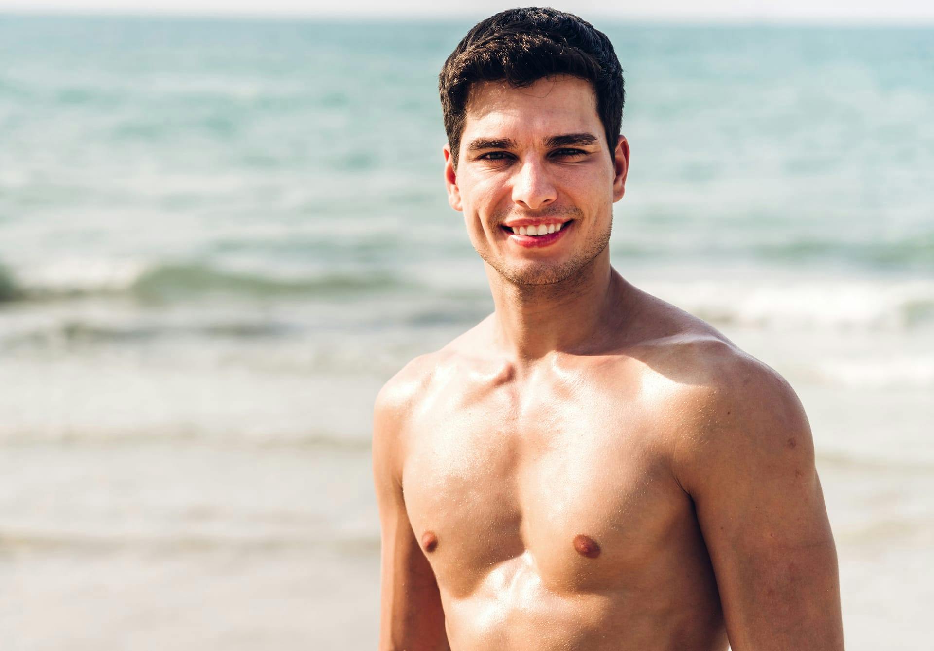 man at the beach smiling