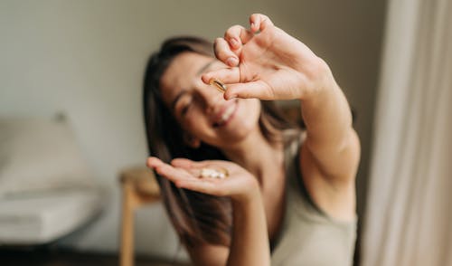 woman holding supplements