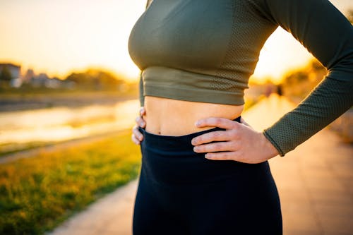 woman in cropped green athletic top