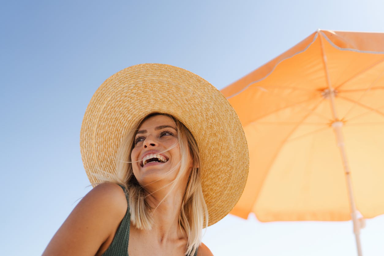 Woman wearing a sunhat at the beach