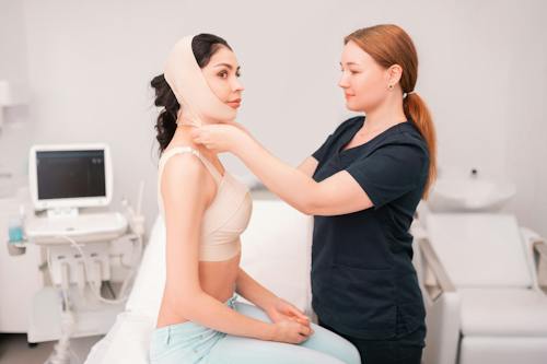woman with bandage on head. Doctor helping her