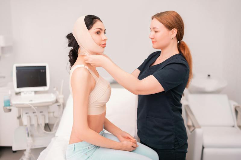 woman with bandage on head. Doctor helping her