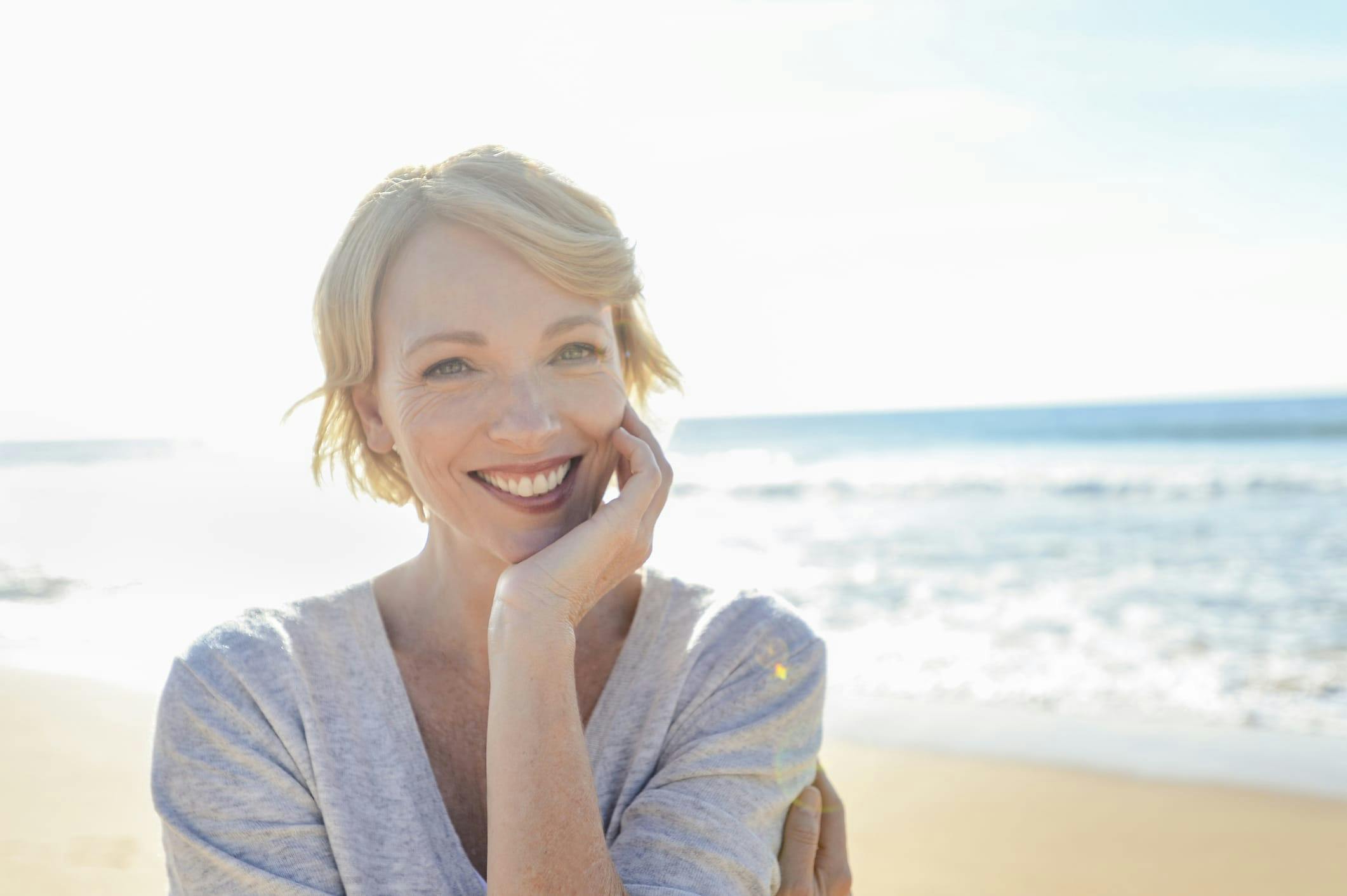 Woman smiling on the beach