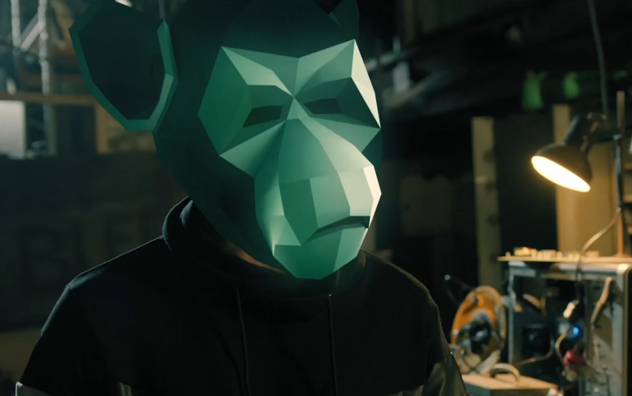 Screencapture of a man wearing an ape mask