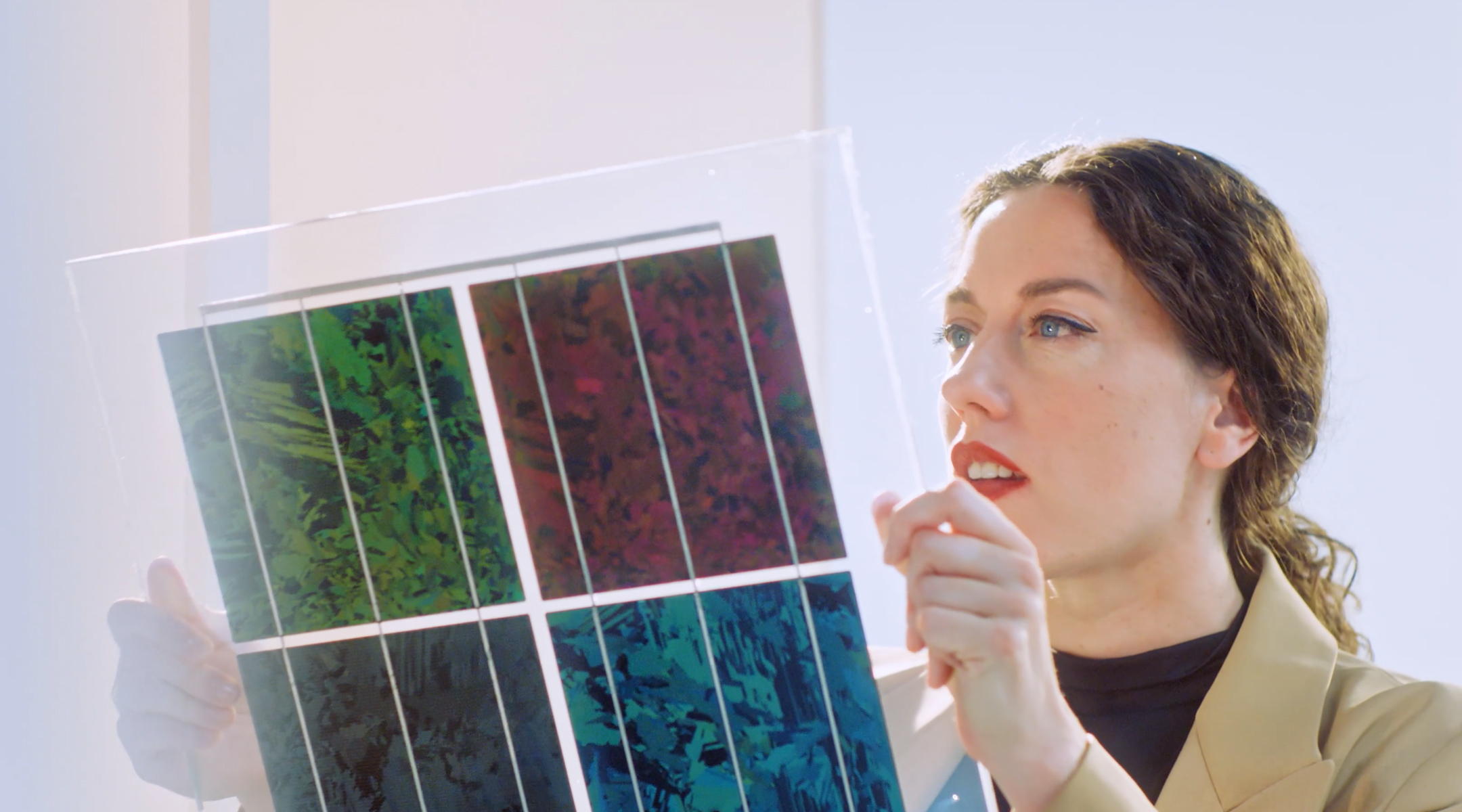 Solar Designer Marjan van Aubel looking at material samples