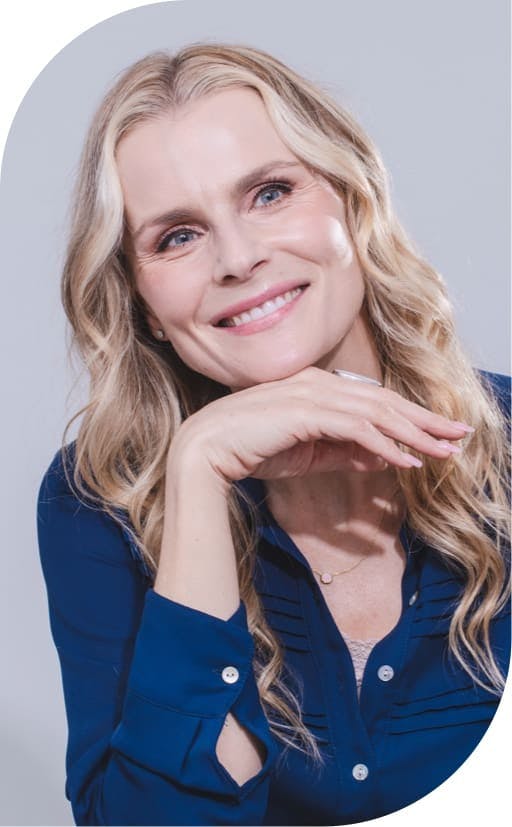 smiling woman after seeing implant dentist burbank