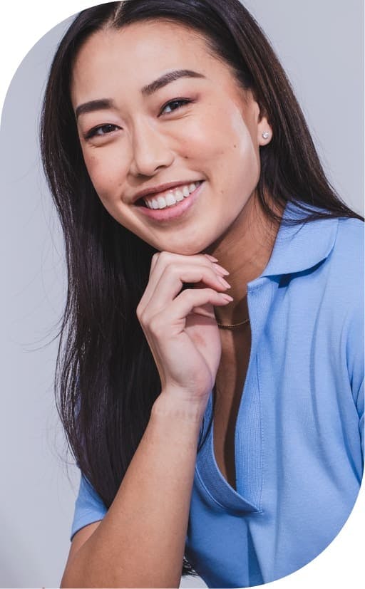 smiling woman after implant dentistry burbank