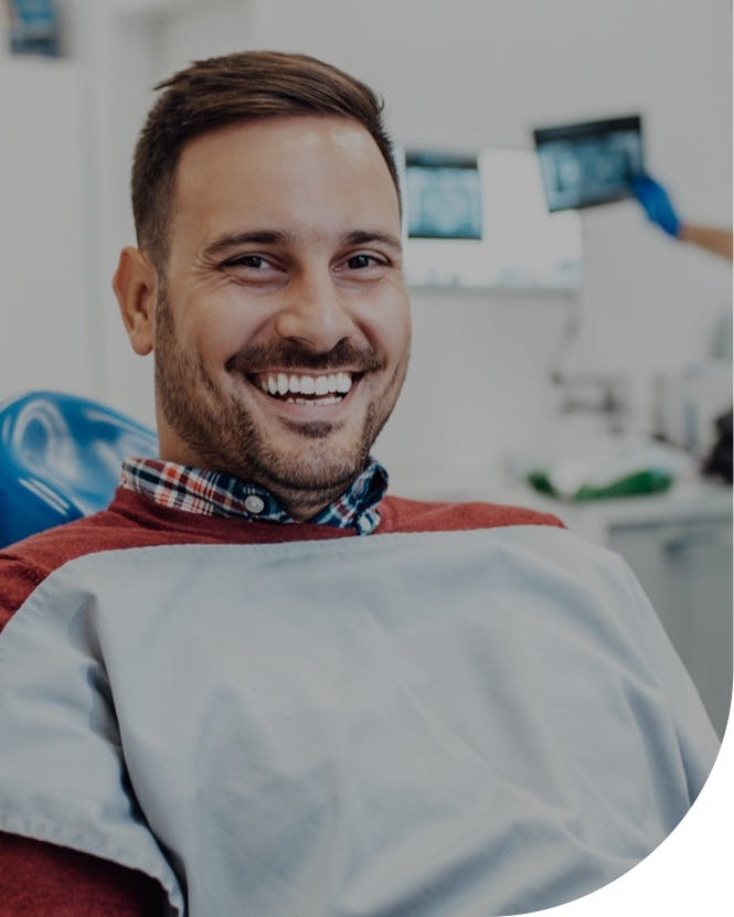 smiling man after seeing implant dentist burbank