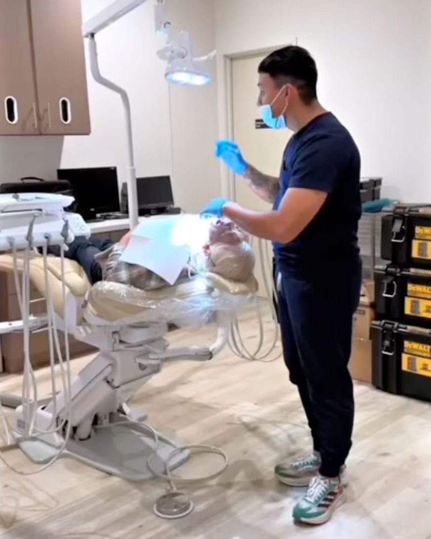 Dentist installing dental bridges in Burbank.