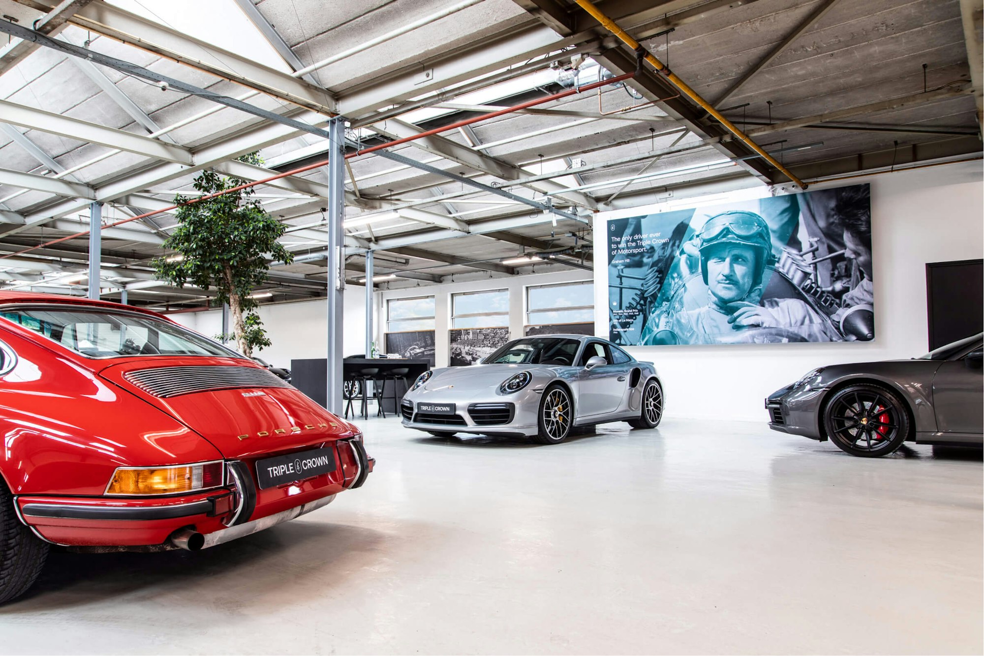 Inside of T.C showroom Triple Crown Stuurmen Porsche in storage branding of shop