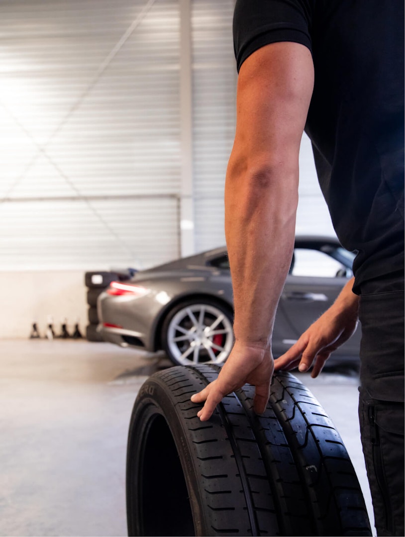 Rolling a wheel inside Porsche shop car retailer Stuurmen Triple Crown