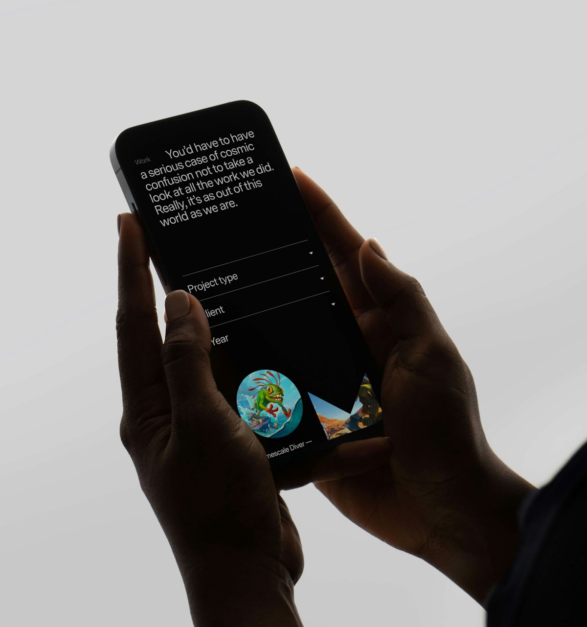 Iphone in hand with mooncolony website open