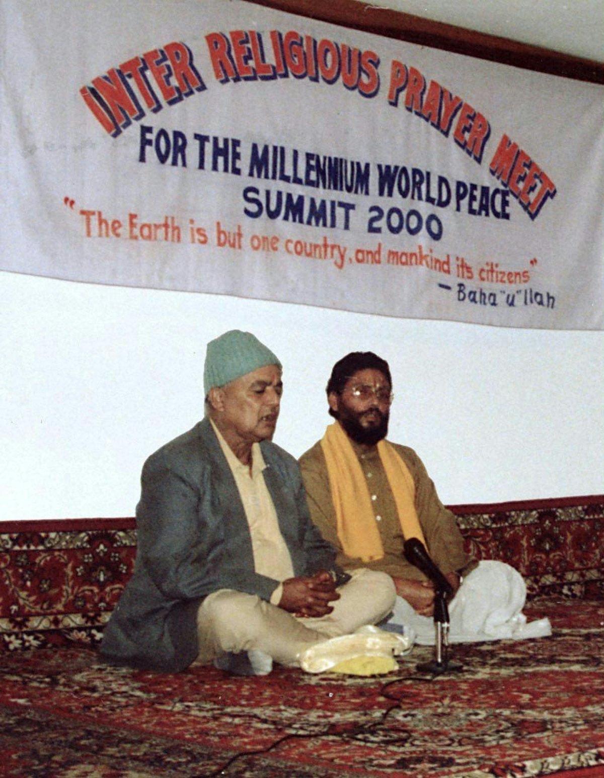 Participants offer prayers during an interfaith meeting organized by the State Baha’i Council of Sikkim, India, on 28 August 2000 to mark the opening of the United Nations Millennium World Peace Summit of Religious and Spiritual Leaders.