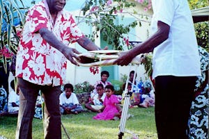 Chief Peter Poilapa receives a Bertha Dobbins Award for his contributions to a culture of peace at the grassroots level.| The award is presented by Peter Kaltoli on behalf of the Baha'is of Vanuatu at the fifth annual celebration of Bertha Dobbins Day, Port Vila, Vanuatu.