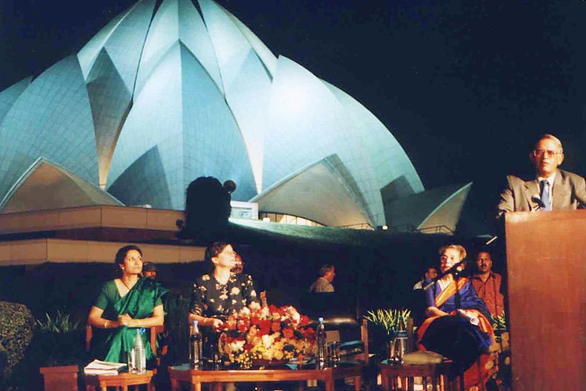 The Lieutenant-Governor of Delhi, Mr. Vijai Kapoor, addressing the inaugural session of the Colloquium on Science, Religion and Development on the grounds of the Baha'i House of Worship.| Seated on the dias (left to right) are Ms. Bani Dugal-Gujral, Director, Office for the Advancement of Women, Baha'i International Community; Ms. Katherine Marshall, Director on Faiths and World Faiths Development Dialogue, Office of the President, World Bank; and Mrs. Zena Sorabjee, Chairperson of the Baha'i House of Worship.