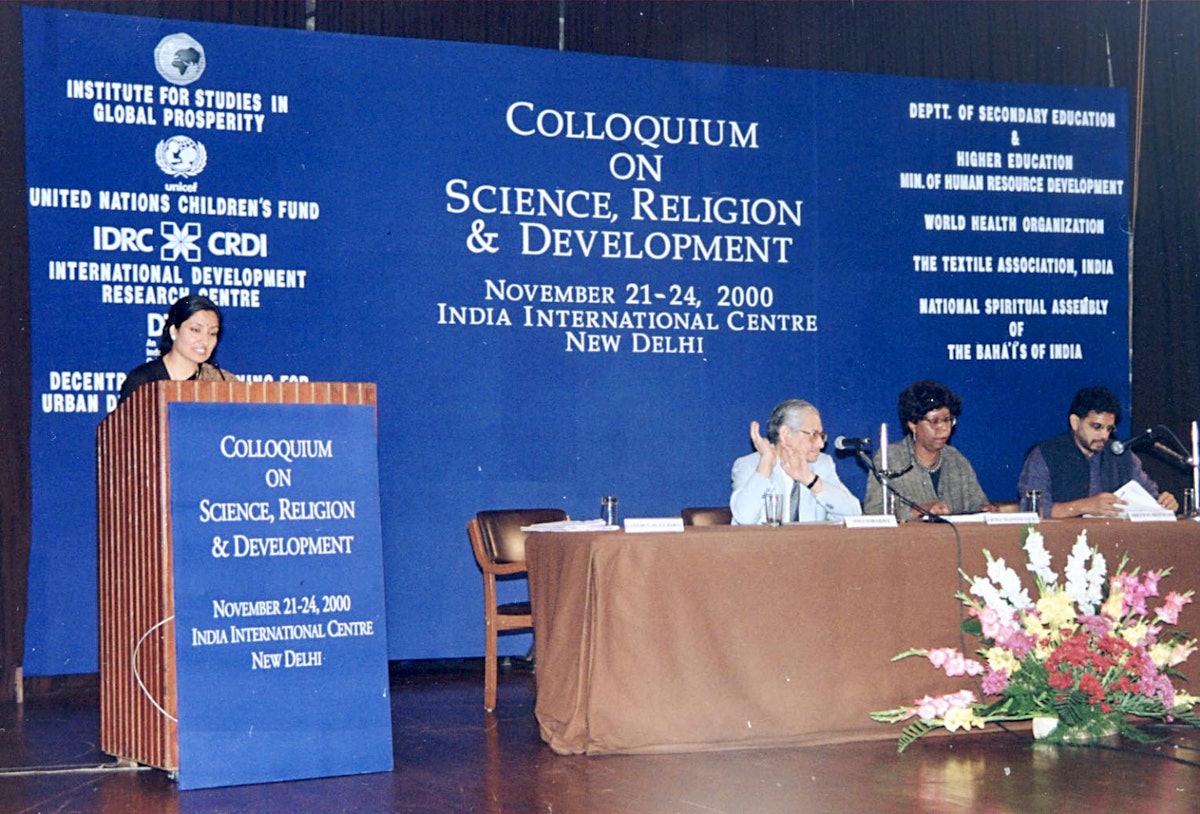 The Colloquium on Science, Religion and Development featured a panel session exploring the relationship between justice and development.| The panel members were (left to right seated at table) Mr. Soli Sorabjee, Attorney General of India; Dr. Erma Manoncourt, Deputy Director, UNICEF, India; and Mr. Miloon Kothari, UN Special Rapporteur on the Right to Adequate Housing. Ms. Bani Dugal-Gugral (standing), Director, Office for the Advancement of Women, Baha'i International Community moderated the session.
