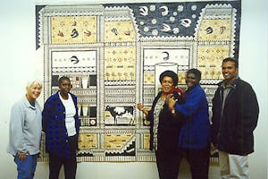 Artists Robin White and Leba Toki in front of the ‘Rewa Milk’ tapa at the Helen Maxwell Gallery, Canberra, Australia. They are with Naminapu, Aboriginal artist-in-residence at the School of Fine Arts at the Australian National University, her daughter Jennifer and her nephew Michael. (Left to right: Robin, Jennifer, Leba, Naminapu, Michael)