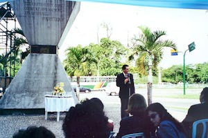 Mr. Iradj Roberto Eghrari speaking on behalf of the Brazilian Baha'i community at a ceremony to deposit soil samples from 26 nations in the hourglass-shaped Peace Monument in Rio de Janeiro.