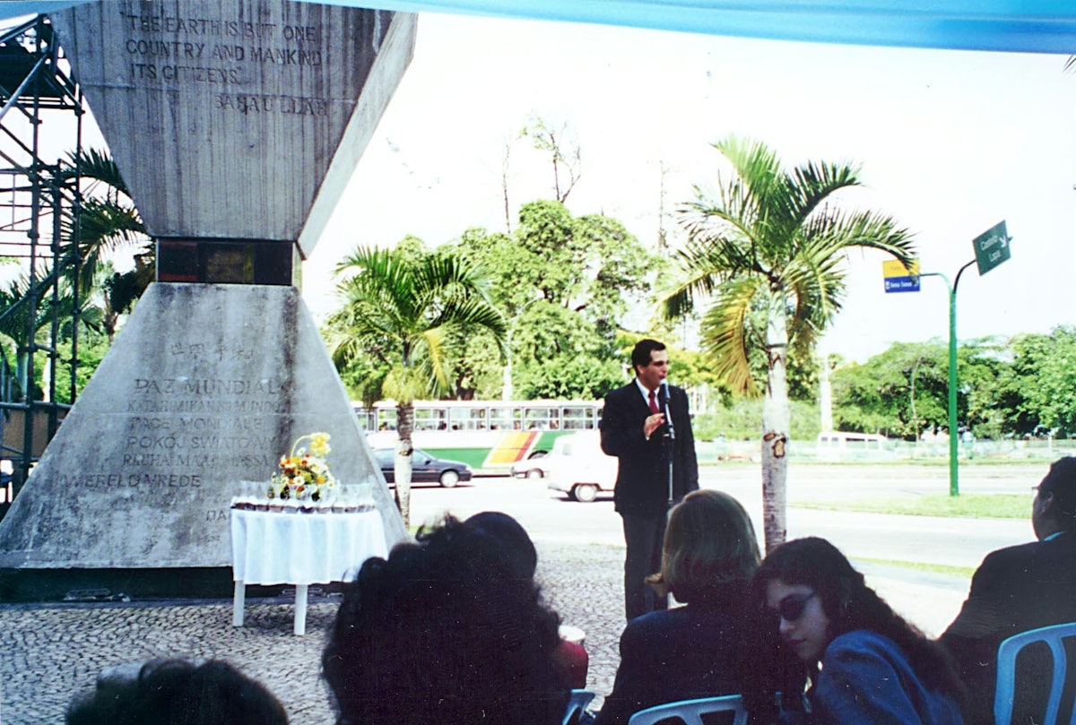 Mr. Iradj Roberto Eghrari speaking on behalf of the Brazilian Baha'i community at a ceremony to deposit soil samples from 26 nations in the hourglass-shaped Peace Monument in Rio de Janeiro.