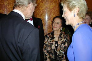 At a 15 May 2001 Arts for Nature event honoring Madame Ruhiyyih Rabbani in London, HRH Prince Philip, Duke of Edinburgh, left, talks with Ms. Violette Nahkjavani, center, in the presence of Ms. Guilda Navidi-Walker, right. Ms. Nakhjavani accompanied Madame Rabbani on her world travels and has recently written a book about her life. Ms. Navidi-Walker was convenor of the event.