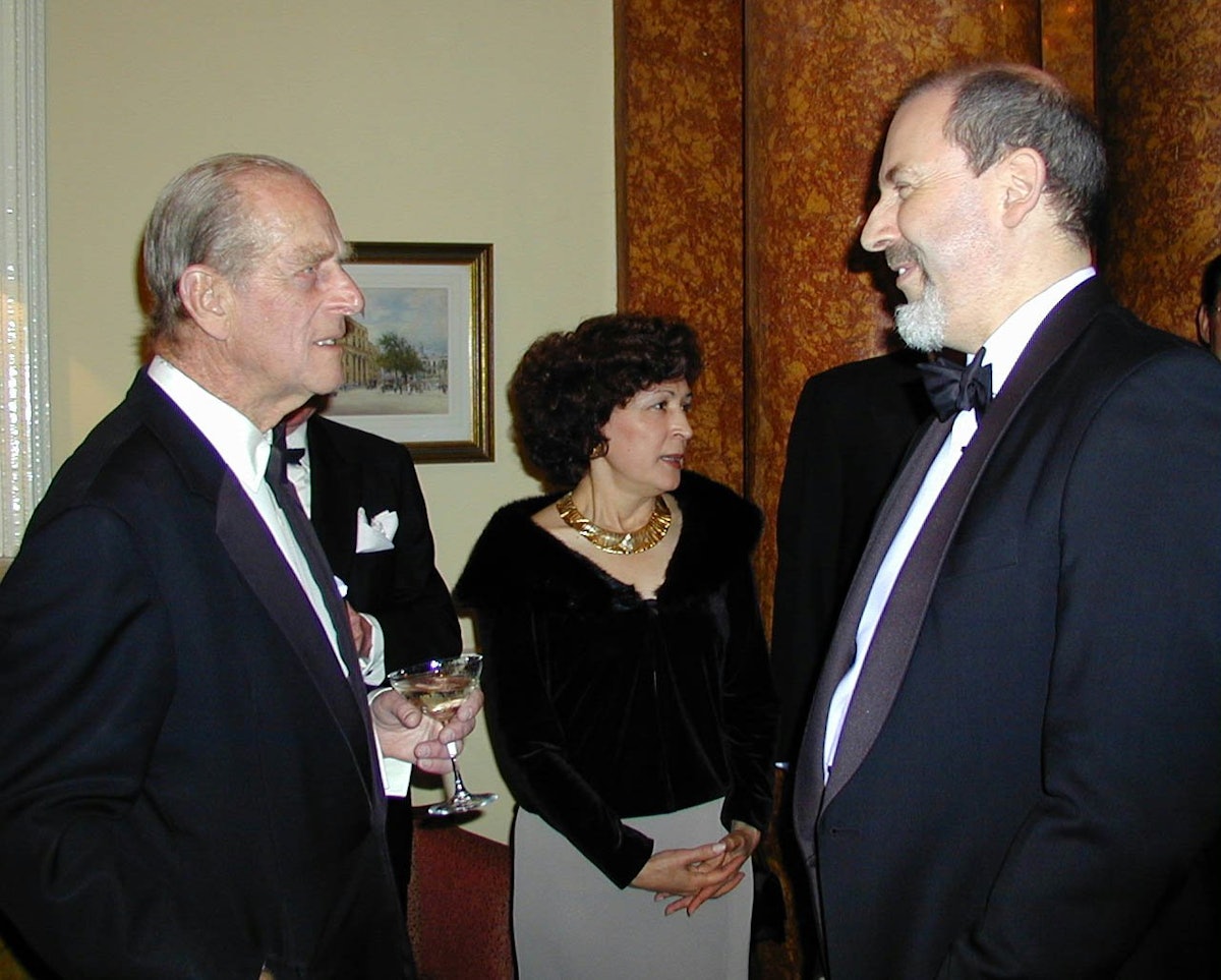 HRH The Prince Philip, Duke of Edinburgh, chats with Barney Leith, secretary of the National Spiritual Assembly of the Baha'is of the United Kingdom, at an Arts for Nature tribute honoring Madame Ruhiyyih Rabbani, held 15 May 2001 in London.