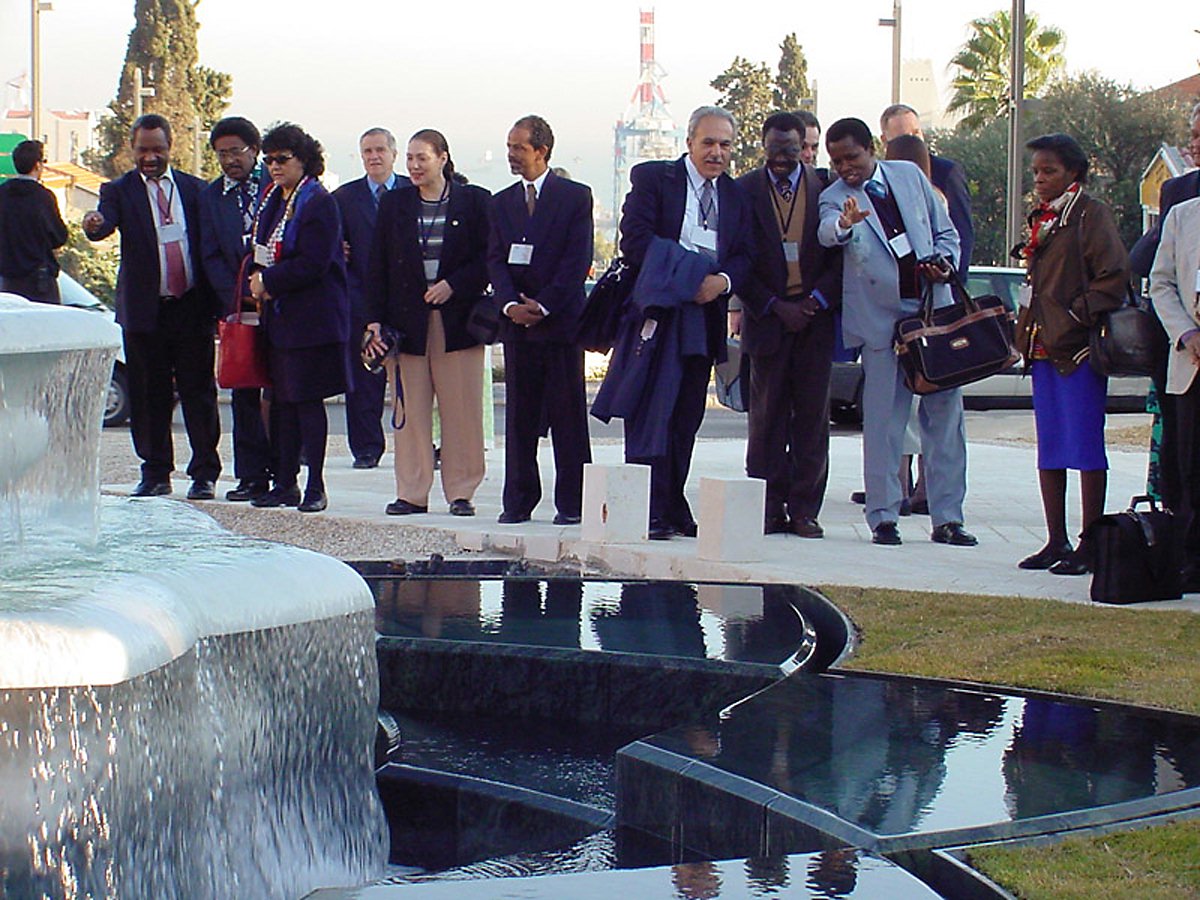 Participants in the conference to inaugurate the International Teaching Centre building on their historic first ascent of the Terraces of the Shrine of the Bab on Mount Carmel on 14 January 2001.