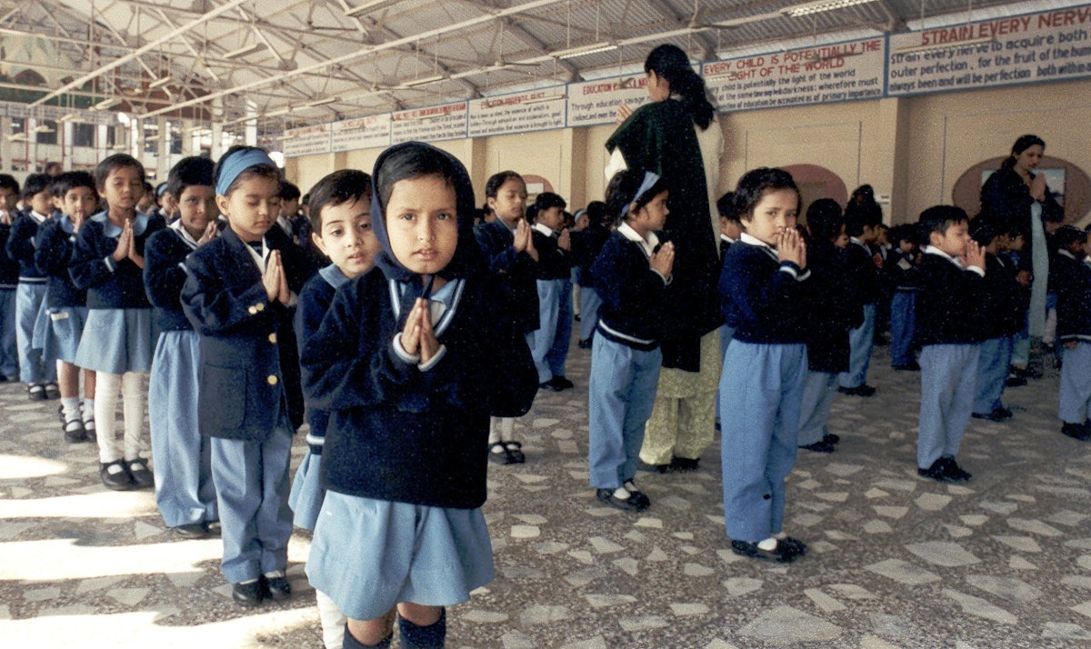 The essential principles of all religions are taught at City Montessori School, and in morning assembly each day the students read prayers from all religions.| Shown here are kindergarten students praying in the morning at the start of the day.