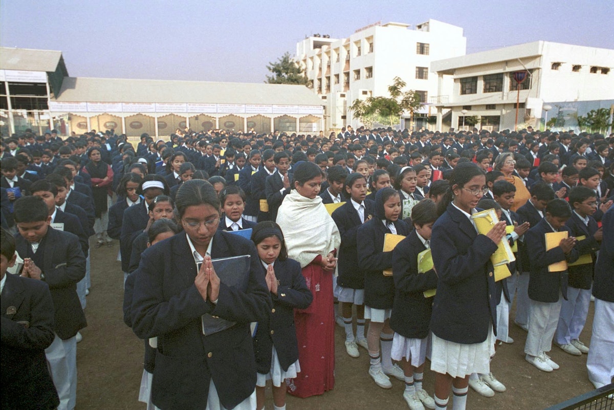 With an enrollment this year of more than 25,000 students, in grades ranging from pre-primary to college, City Montessori School nevertheless has a high academic reputation.| Shown here is morning assembly at the Gomti Nagar branch, one of 20 branches in Lucknow. Each branch is a small, self-contained campus, with about 1,250 students.