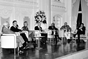 More than 400 people gathered in Stuttgart, Germany, for a World Religion Day commemoration sponsored by the Baha'i Community of Germany on 20 January 2002 to hear a panel discussion on “Religions against Violence.”| Shown, left to right, are the panelists: Meinhard Tenné, Central Jewish Council of Germany; Dr. Paul Köppler, German Buddhist Union; Prof. Urs Baumann, University of Tübingen, Department of Theology; Dr. Andreas Rössler, Chief Editor, Evangelisches Gemeindeblatt für Württemberg; Dr. Nadeem Elyas, President, Central Muslim Council of Germany; Christopher Sprung, National Spiritual Assembly of the Baha'is of Germany; and Dr. Johannes Frühbauer of Hans Küng's Foundation for World Ethics.