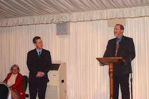 Barney Leith, Secretary-General of the Bahá'í Community of the United Kingdom, addresses the some one hundred participants at the Bahá'í new year's reception in the British House of Commons on 21 March.| MP Lembit Opik, Chair of the All Party Parliamentary Friends of the Bahá'ís, stands to the right.