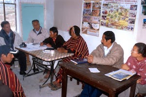 Members of the Local Spiritual Assembly of the Bahá’ís of Puka Puka consult with visitors about their plans for improving education in the community. The Assembly is the locally elected Bahá’í governing council; in Puka Puka, it was responsible for initiating many of the education plans.