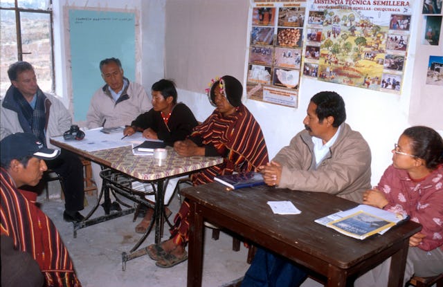 Members of the Local Spiritual Assembly of the Bahá’ís of Puka Puka consult with visitors about their plans for improving education in the community. The Assembly is the locally elected Bahá’í governing council; in Puka Puka, it was responsible for initiating many of the education plans.