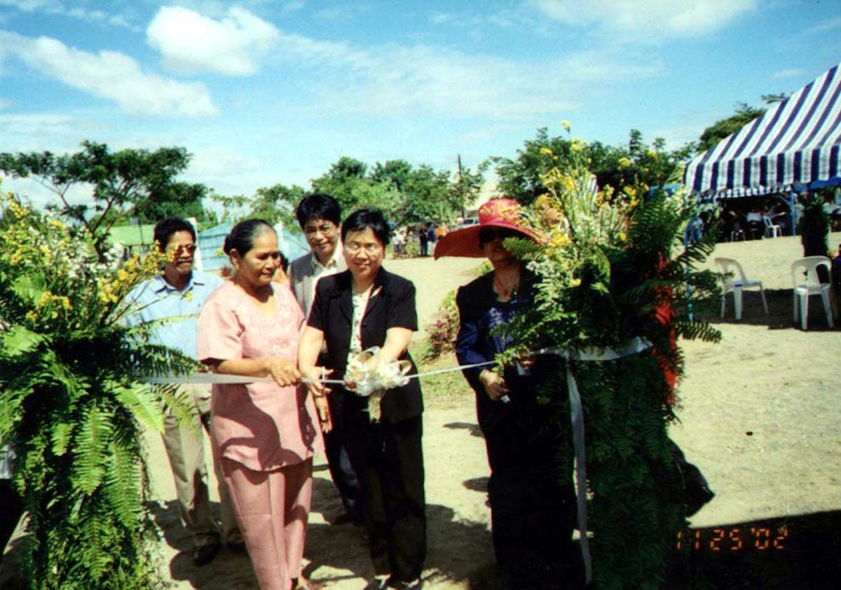 More than 300 people attended the official inauguration of the new Baha’i radio station on 26 November 2002 in the Philippines.| At a ribbon cutting ceremony, shown left to right are: Edilberto Tamis, a member of the National Spiritual Assembly of the Baha’is of the Philippines; Gloria Santiago, chairwoman of the local Bulac barangay; Antonio Toledo, chairman of the Dawnbreakers Foundation and a member of the National Spiritual Assembly; Zenaida Ramirez, a member of the International Teaching Center at the Baha’i World Center; and Sheila Ruita-Manayaga, a member of the National Spiritual Assembly.