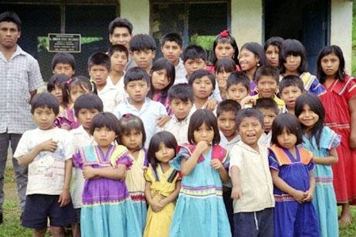 The students of the Baha'i school at Quebrada Venado in Western Panama. In the back row, at left, is Victorino Rodriguez, their teacher.