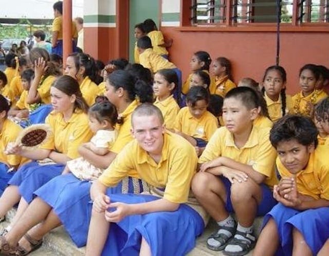 Students at the opening of the new buildings at the Ocean of Light International School reflect a diversity of backgrounds.