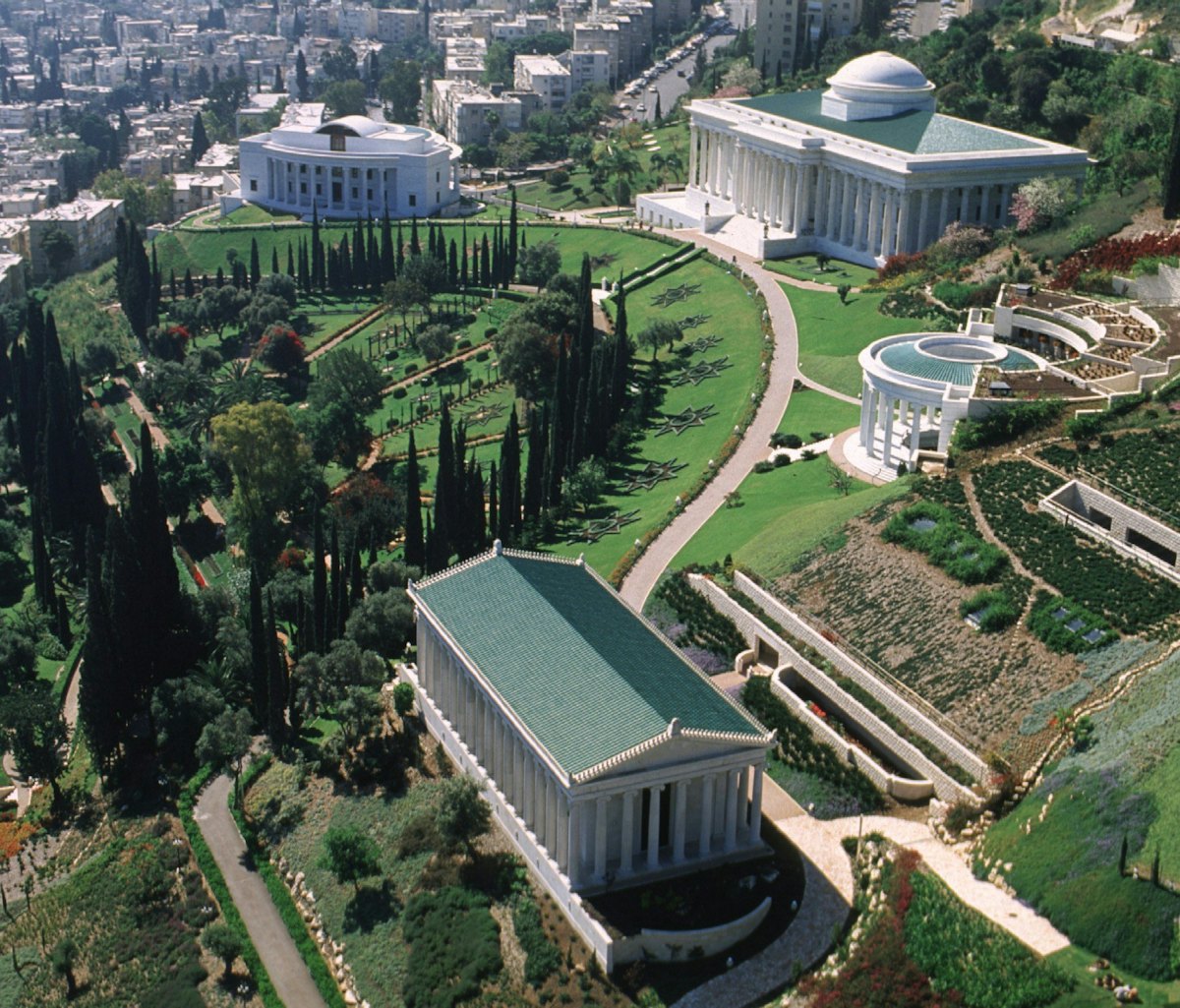 The Seat of the Universal House of Justice is the home of the Baha'i Faith's international governing body.| The Seat is flanked at left by the Seat of the International Teaching Centre, at right by the Centre for the Study of the Sacred Texts, and, in the foreground, by the International Archives Building.