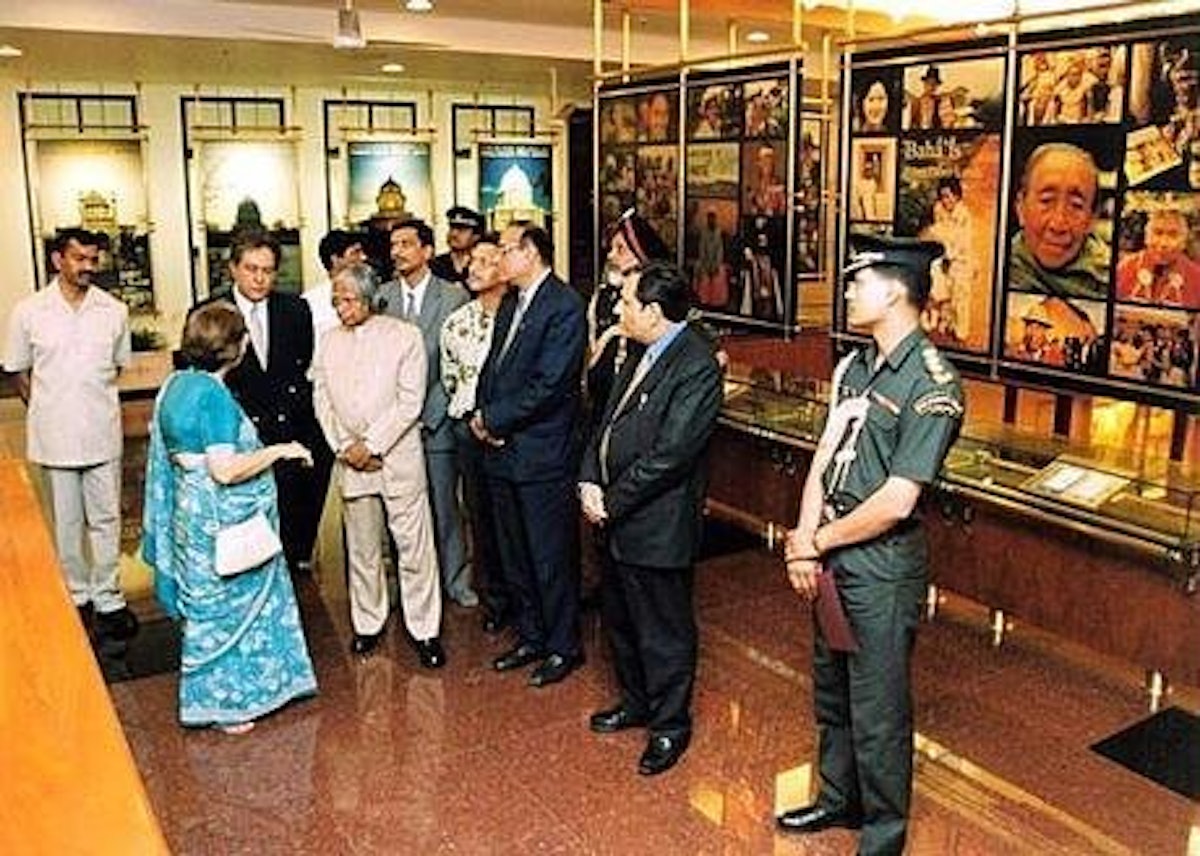 At the public information center of the Baha'i House of Worship, President Kalam of India listens to an explanation of the displays from Counsellor Zena Sorabjee.