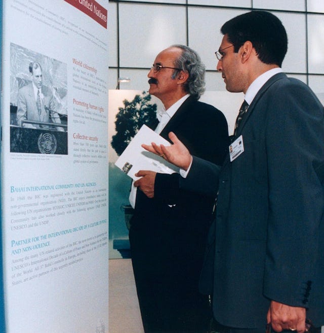 Socrates Maanian, secretary of the National Spiritual Assembly of the Baha'is of Greece introduces the exhibition to Efstratios Korakas, a member of the European Parliament. (Photo: European Parliament)