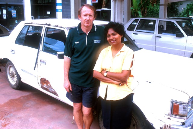 Tony Deamer and his wife, Easuary, with one of his first test vehicles.