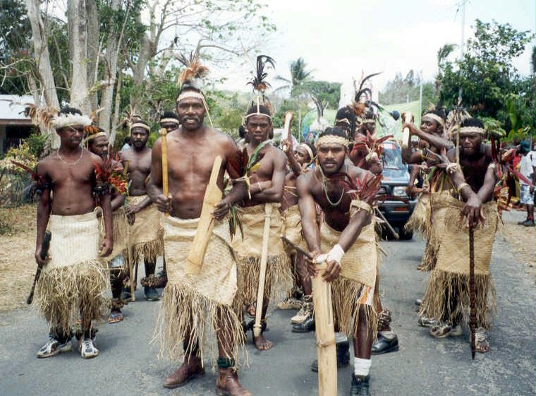 Traditional dancers from Vanuatu's Tongoa island starting the jubilee parade from Baha'i Street, just outside the national Baha'i center.