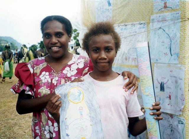 Stephanie Melenamu (right), one of three prizewinners in the jubilee poster competition with a member of the Baha'i National Education Committee, Annick Moltaban.