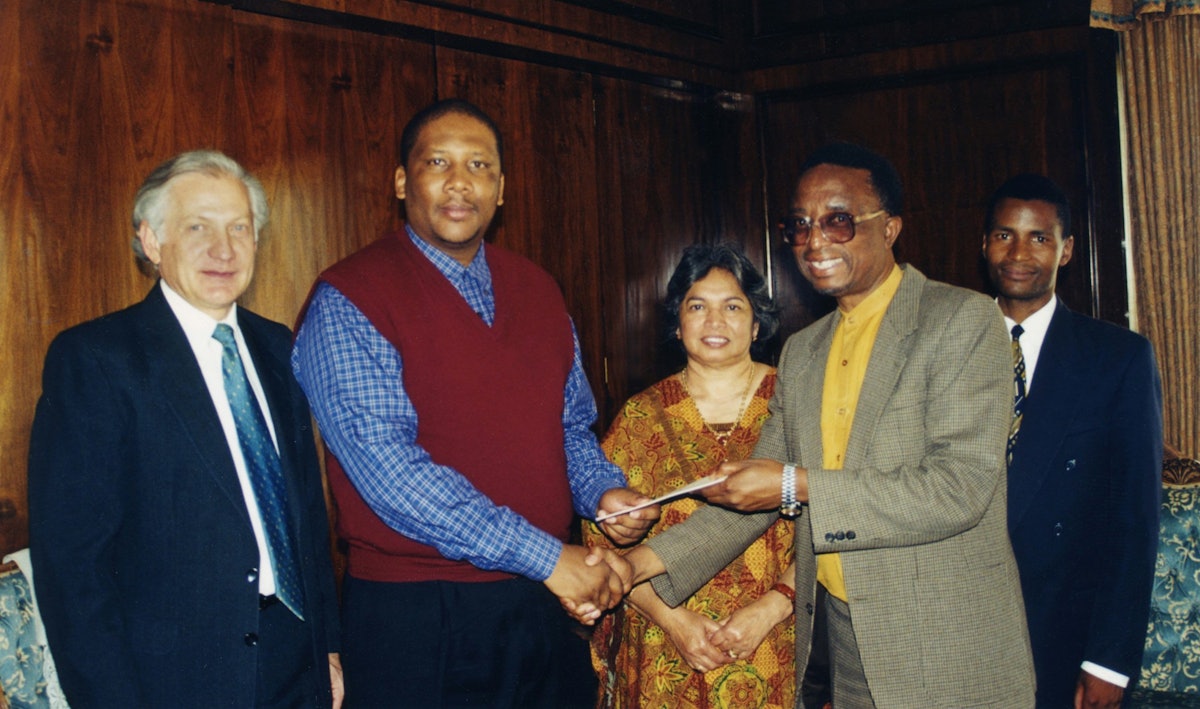 Baha'is present the publication "Who Is Writing the Future?" to His Majesty King Letsie III (second from left) at the Royal Palace in Lesotho, 1999.