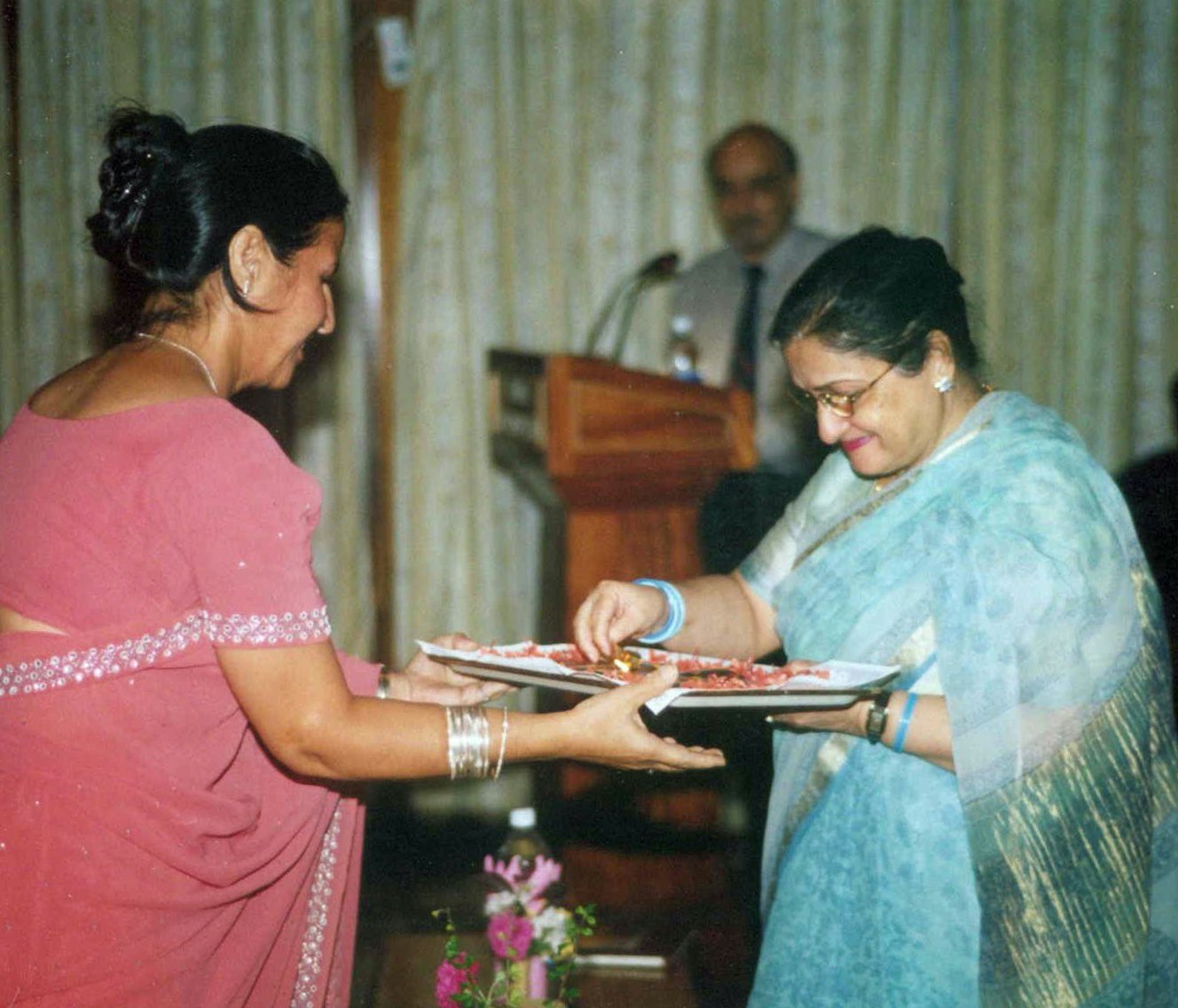 First Lady of Andaman and Nicobar Islands, Smti Chaya Jha, (right, with the souvenir of the jubilee.